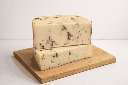 Sakura cherry blossom cheese with salted pressed blossoms on a plate